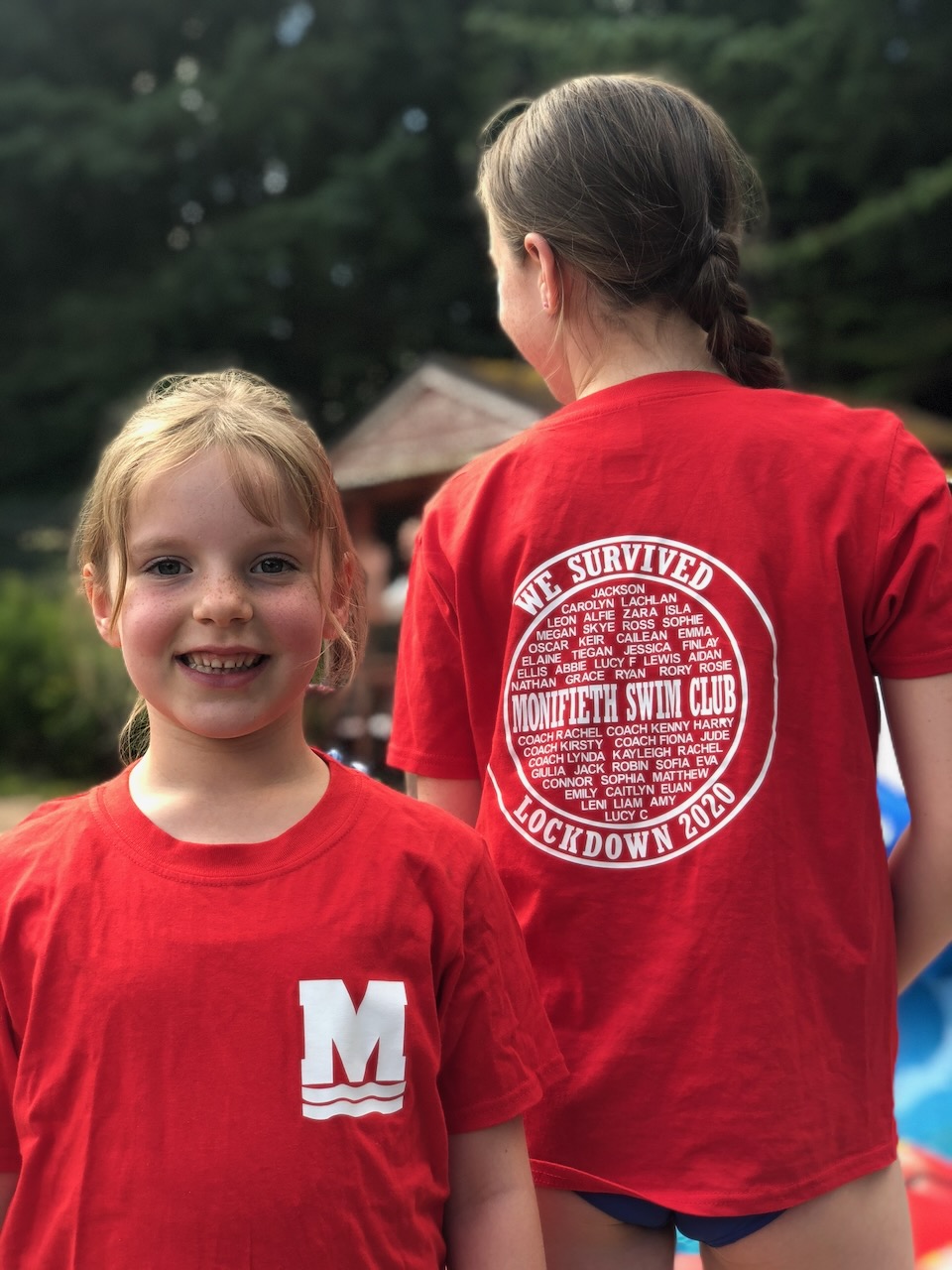 Young club members wearing red Monifieth Swim Club shirts